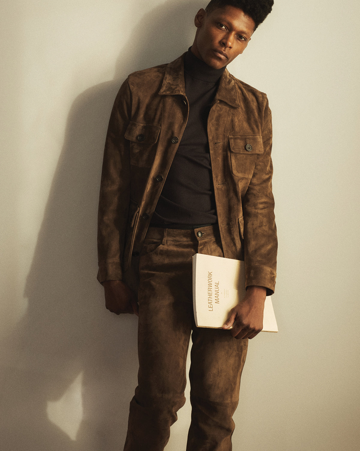 A man wearing a full-suede look in brown by Savas