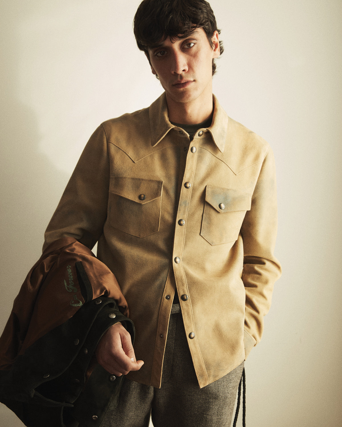 A man wearing a suede Savas jacket