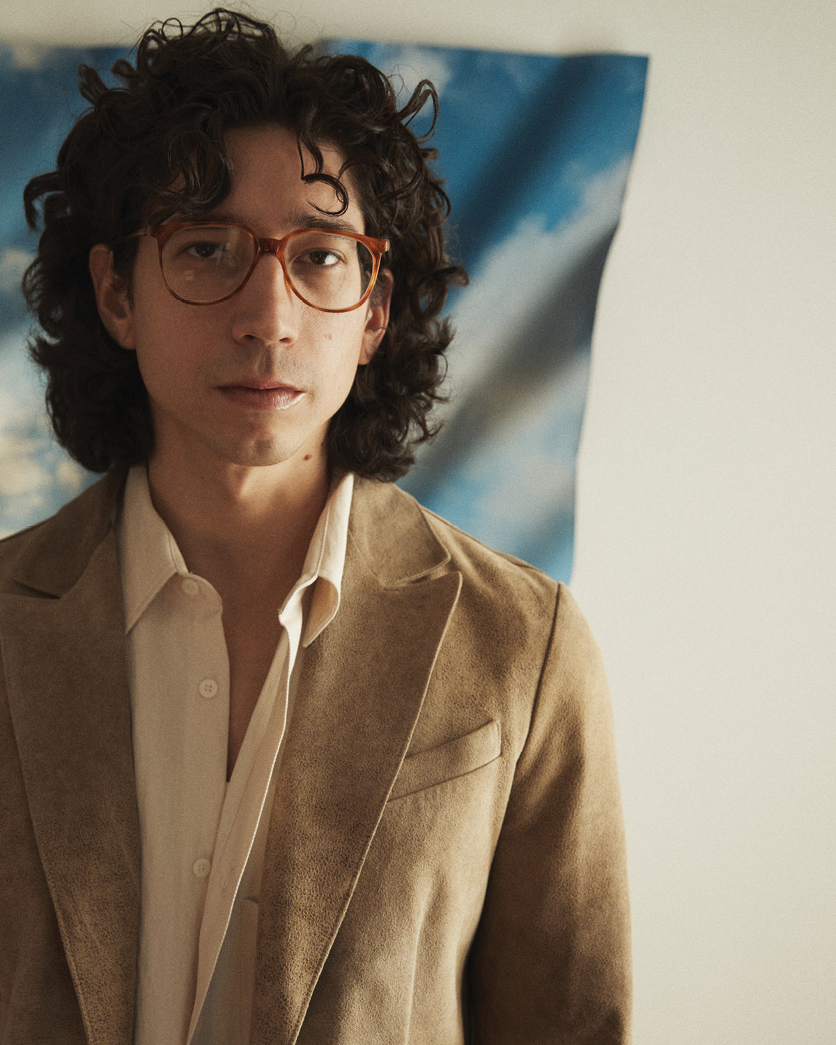 Close-up of a man wearing a Savas suede blazer